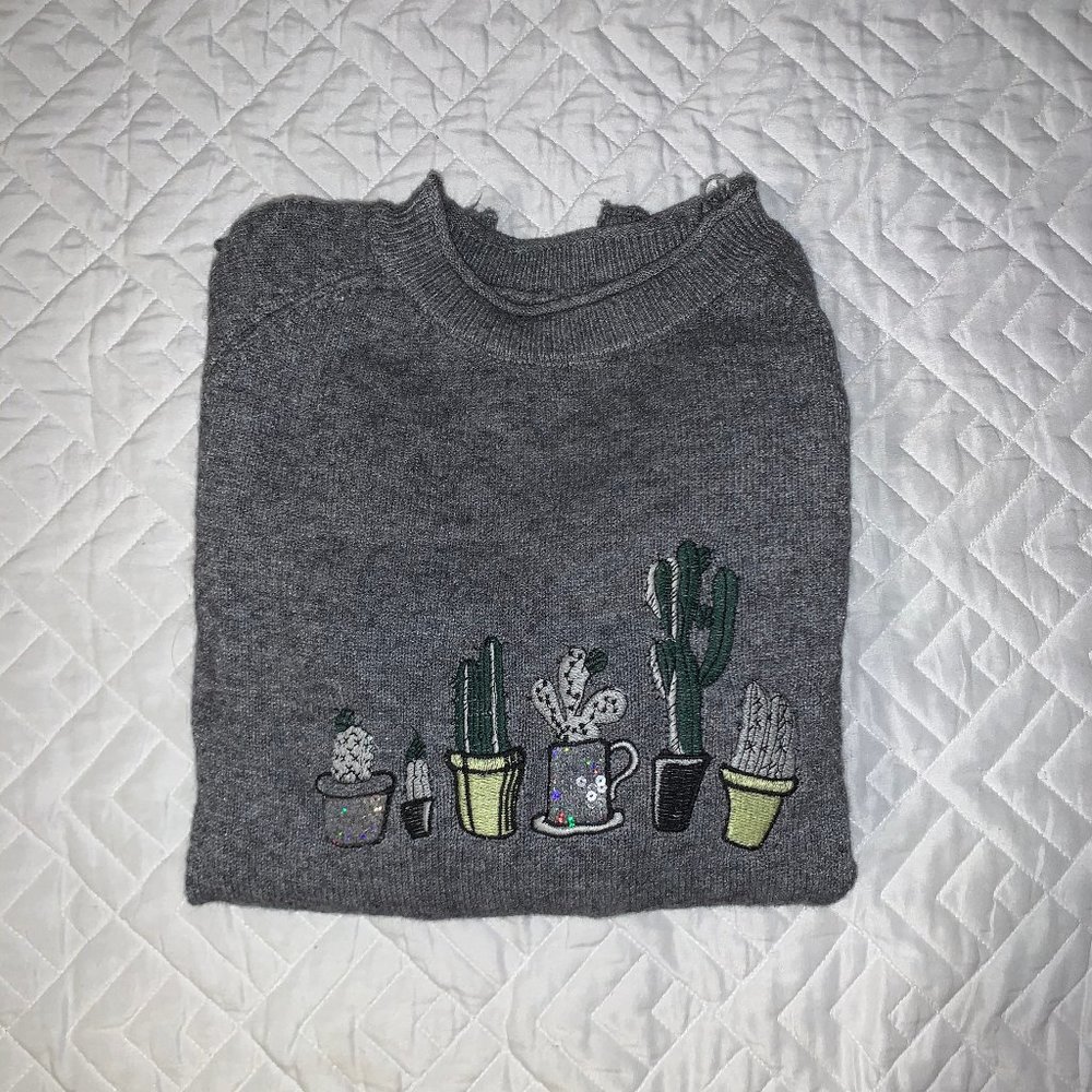 gray sweater with cacti
